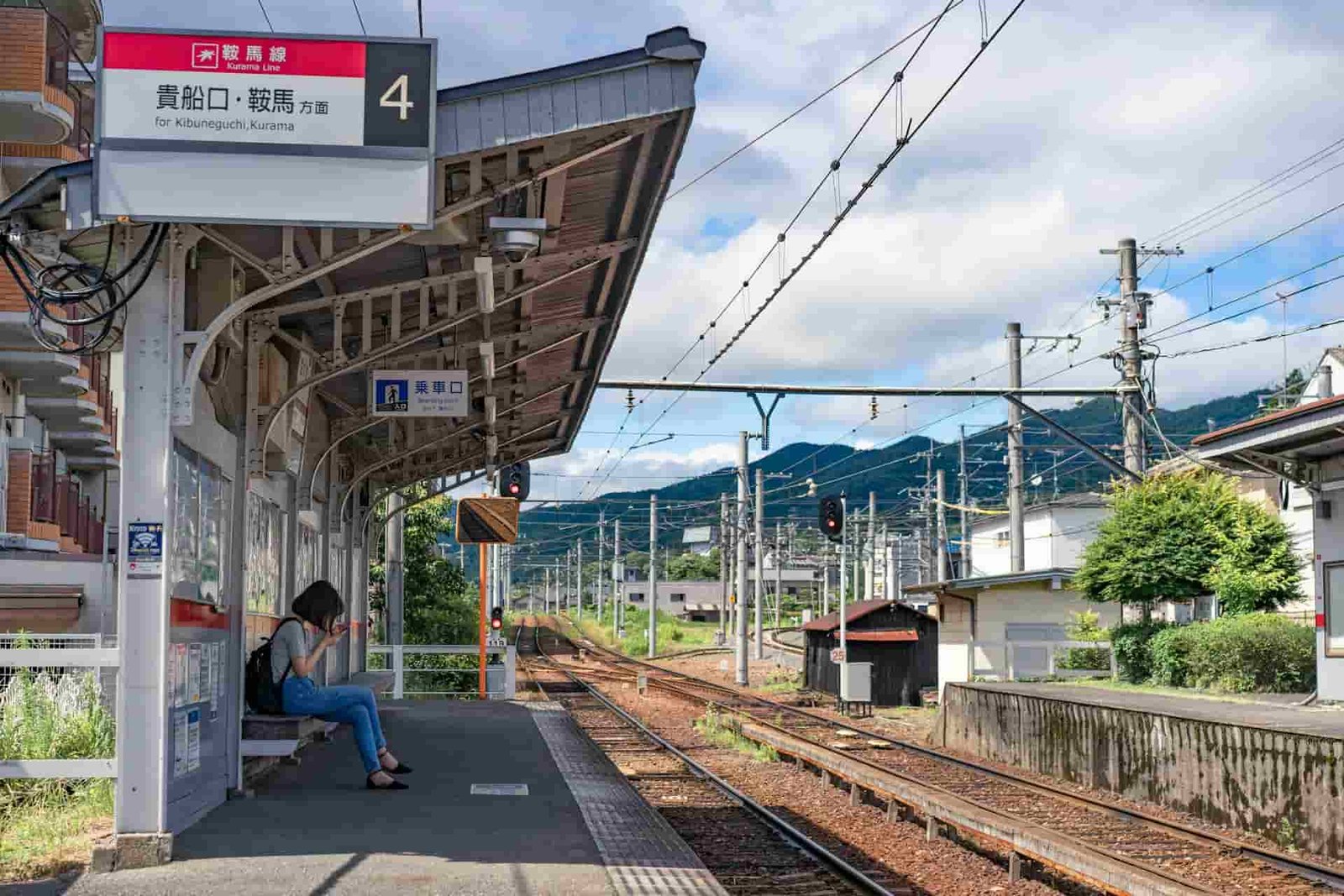 Woman waiting on a Japanese train station
